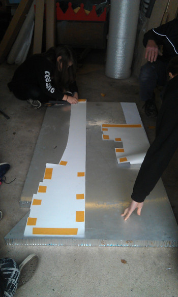 Attaching sticky tape on wing template