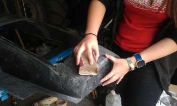 Sanding the excess epoxy